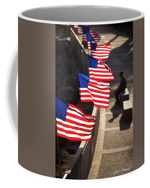 In Focus Coffee Mug featuring the photograph Veteran With Our Nations Flags by John A Rodriguez