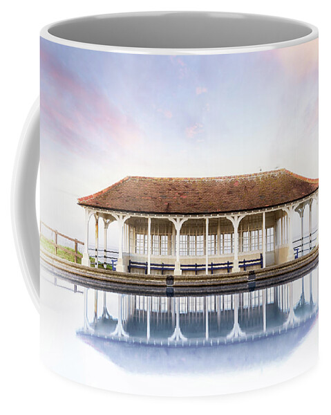 Sheringham Coffee Mug featuring the photograph Norfolk victorian seaside shelter with pink sunset sky by Simon Bratt