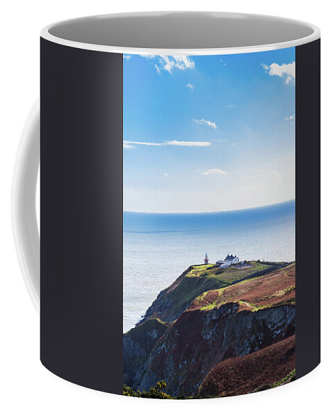 Baily Lighthouse Coffee Mug featuring the photograph View of the trails on Howth Cliffs with the lighthouse in Irelan by Semmick Photo