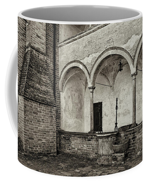 Abbey Coffee Mug featuring the photograph Well and arcade by Roberto Pagani