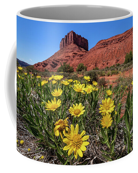 Castle Valley Coffee Mug featuring the photograph Wildflowers and Butte by Peter Tellone