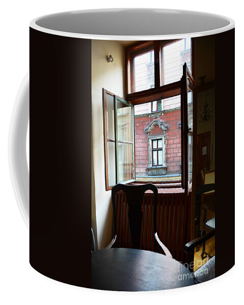 Krakow Coffee Mug featuring the photograph Window on the Street by Elaine Berger