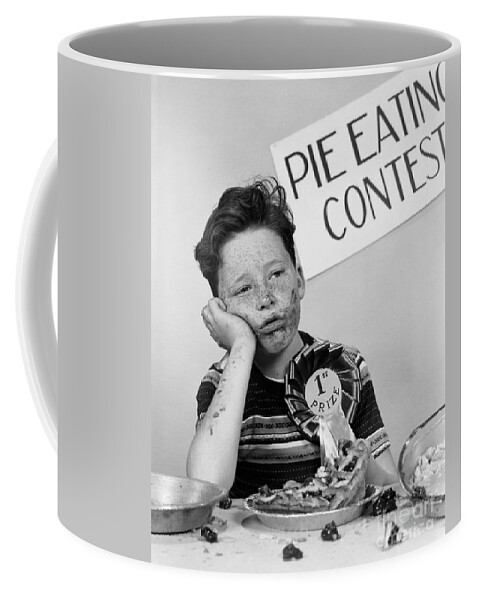 1950s Coffee Mug featuring the photograph Winner Of Pie-eating Contest, C.1950s by H Armstrong Roberts ClassicStock
