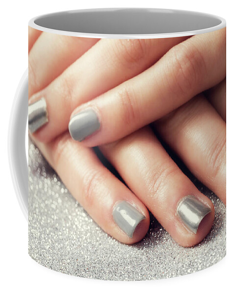 Nail Coffee Mug featuring the photograph Woman's nails with shiny silver hybrid manicure by Michal Bednarek