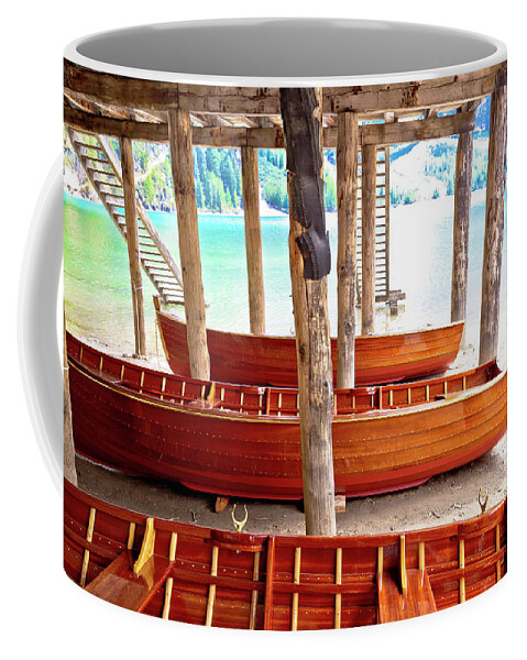 Prags Coffee Mug featuring the photograph Wooden boats under boat house on Braies lake by Brch Photography