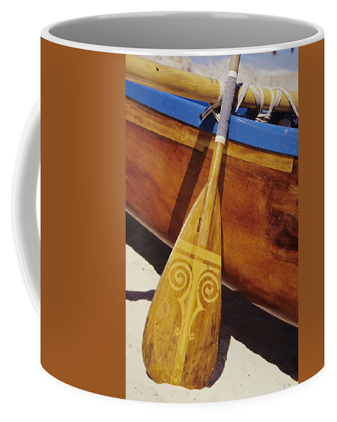 Aku Coffee Mug featuring the photograph Wooden Paddle And Canoe by Joss - Printscapes