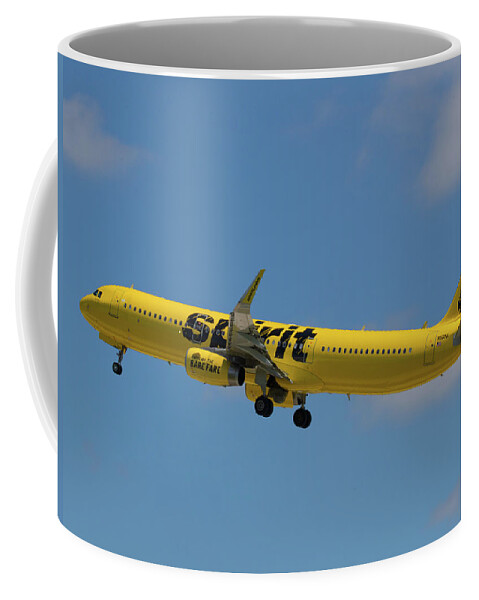 Spirit Coffee Mug featuring the photograph Yellow Spirit Airplane Takes Flight at FLL by Dart Humeston