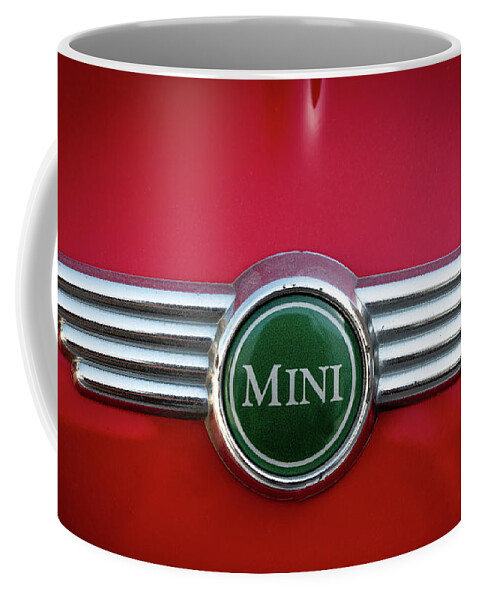 Mini Coffee Mug featuring the photograph Mini Cooper car logo on red surface #2 by Michalakis Ppalis