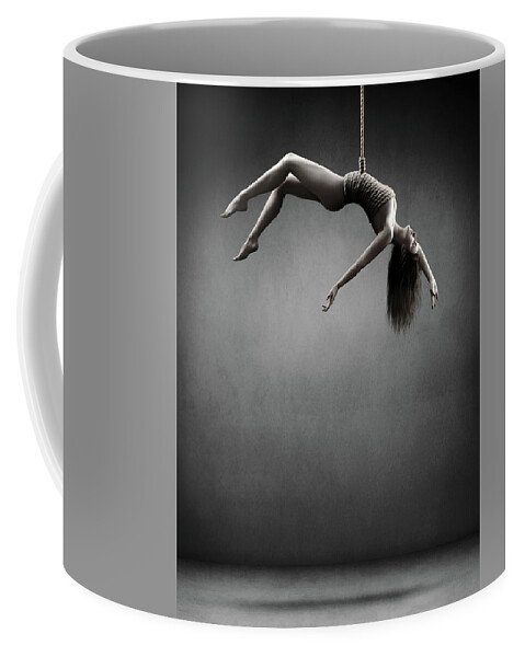 Woman Coffee Mug featuring the photograph Woman hanging on a rope by Johan Swanepoel