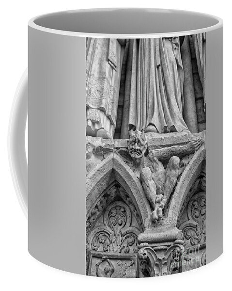 Notre Dame Coffee Mug featuring the photograph Sad gargoyle by Patricia Hofmeester
