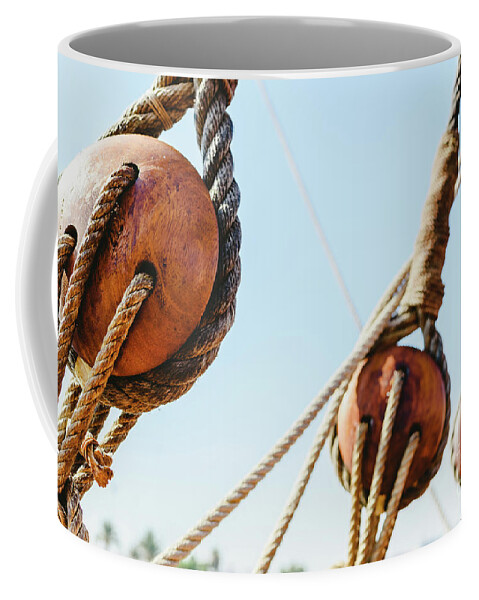 Adventure Coffee Mug featuring the photograph Rigging and ropes on an old sailing ship to sail in summer. #2 by Joaquin Corbalan
