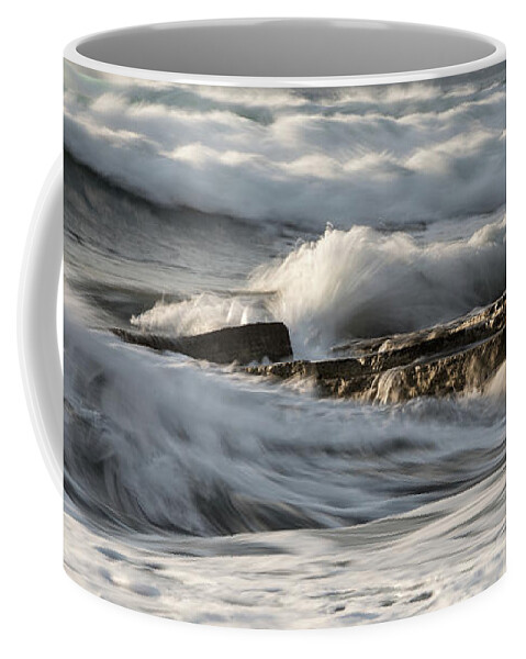 Seascape Coffee Mug featuring the photograph Rocky seashore with wavy ocean and waves crashing on the rocks #5 by Michalakis Ppalis