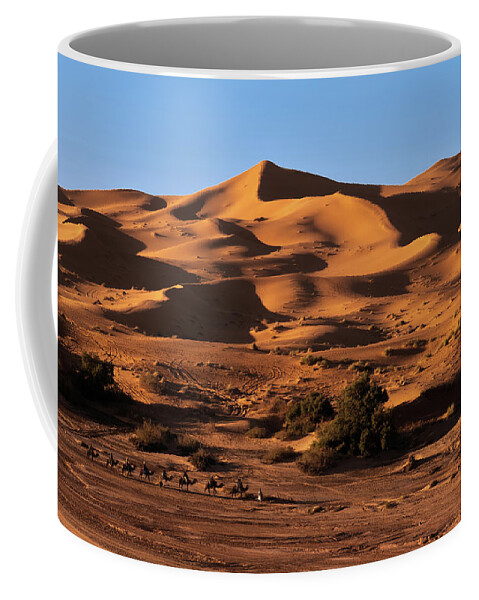 Sand Coffee Mug featuring the photograph A caravan in the desert by Claudio Maioli