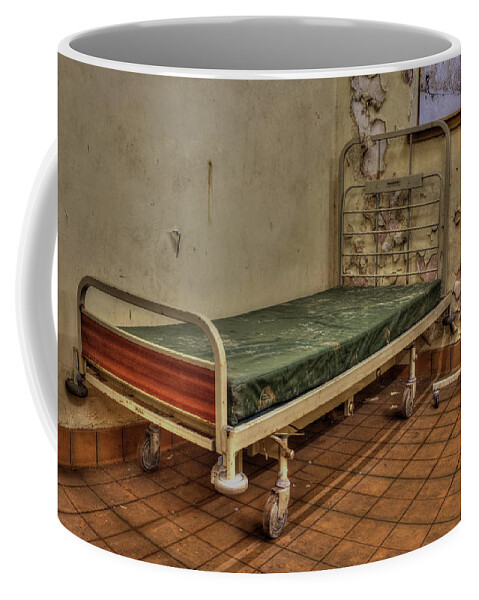 Bed Coffee Mug featuring the photograph Abandoned hospital bed by Steev Stamford