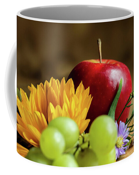 Summer Coffee Mug featuring the photograph An autumn gifts still life on the blurred background by Marina Usmanskaya