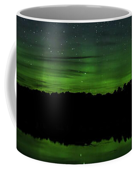 Aurora Borealis Coffee Mug featuring the photograph Aurora Between The Trees by Dale Kauzlaric