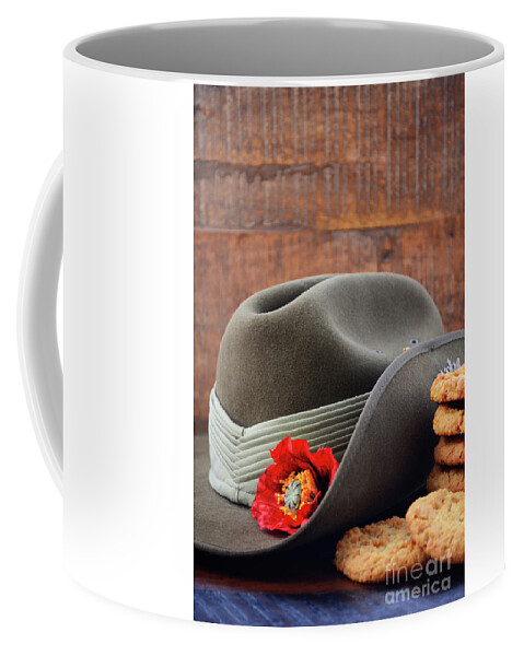 Rustic Coffee Mug featuring the photograph Australian Army Slouch Hat and Anzac Biscuits. by Milleflore Images