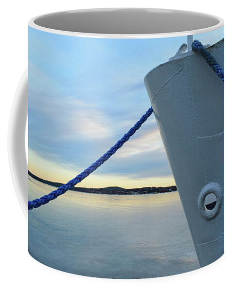 Bay Coffee Mug featuring the photograph Blue rope and ship's bow in an icy harbor by Intensivelight
