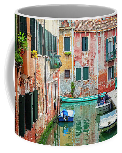 Venice Coffee Mug featuring the photograph Boats on a Venetian Canal by Lowell Monke