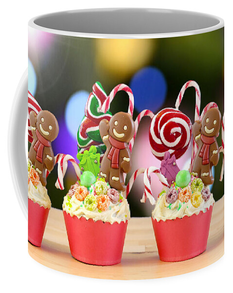 Christmas Coffee Mug featuring the photograph Candyland festive Christmas cupcakes. by Milleflore Images