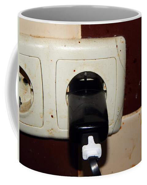 Charger Coffee Mug featuring the photograph Charger in the outlet by Oleg Prokopenko