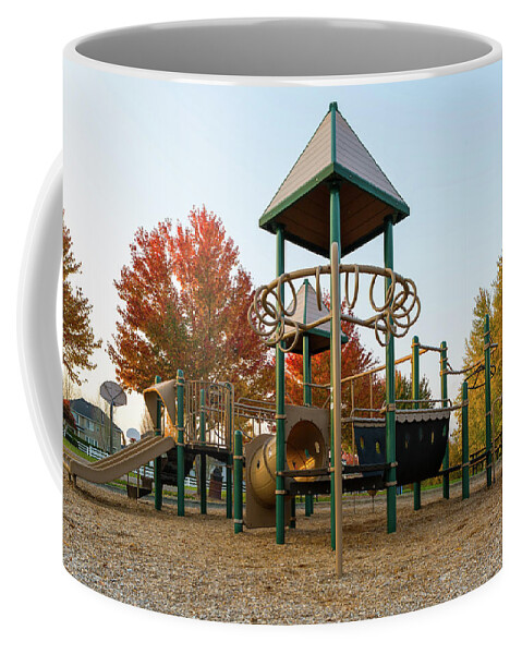 Children Coffee Mug featuring the photograph Children Playground in Neighborhood Park in Fall Season by David Gn