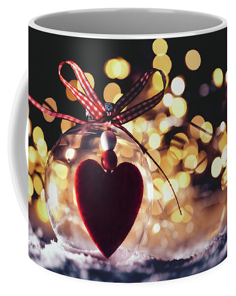 https://render.fineartamerica.com/images/rendered/default/frontright/mug/images/artworkimages/medium/2/christmas-glass-ball-with-a-heart-inside-on-snow-michal-bednarek.jpg?&targetx=125&targety=0&imagewidth=549&imageheight=333&modelwidth=800&modelheight=333&backgroundcolor=A36B57&orientation=0&producttype=coffeemug-11