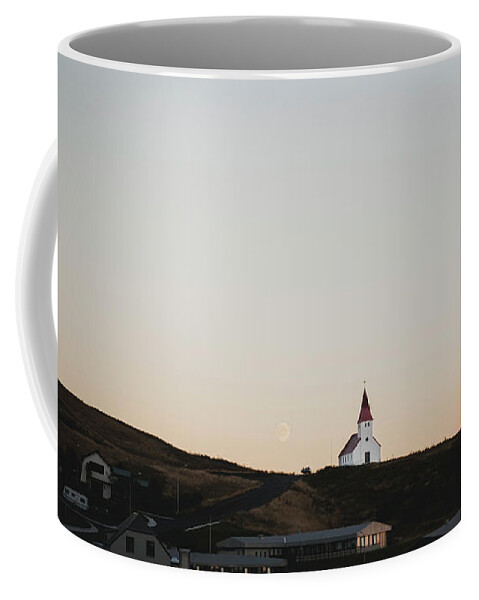 Architecture Coffee Mug featuring the photograph Church on top of a hill and under a mountain, with the moon in the background. by Joaquin Corbalan