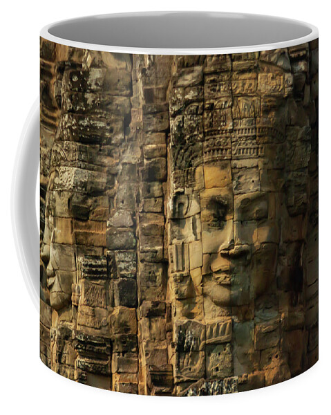 Ancient Coffee Mug featuring the photograph Close up of faces on towers at Bayon Temple in Angkor Tom, Siem by Karen Foley