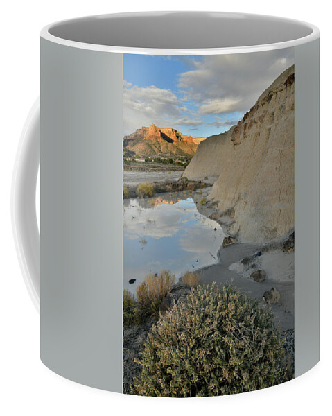 Grand Junction Coffee Mug featuring the photograph Colorado National Monument at Sunrise Reflected in Bentonite Pool by Ray Mathis