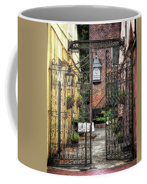 Architecture Coffee Mug featuring the photograph Court of the Two Sisters Courtyard Gate by Susan Rissi Tregoning
