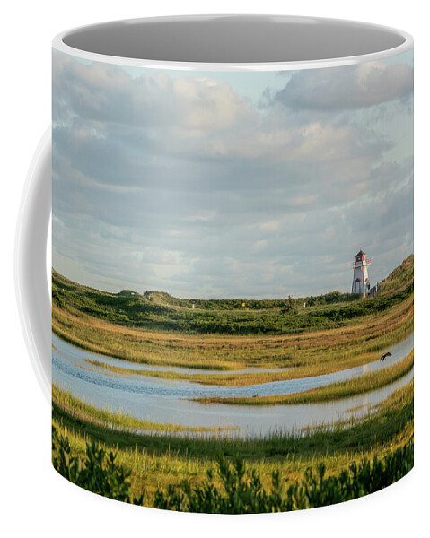 Stanhope Coffee Mug featuring the photograph Cove Head Lighthouse across Wetlands by Douglas Wielfaert