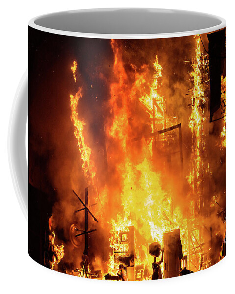 Artist Coffee Mug featuring the photograph Detail of a Falla Valenciana burning between flames of fire. by Joaquin Corbalan
