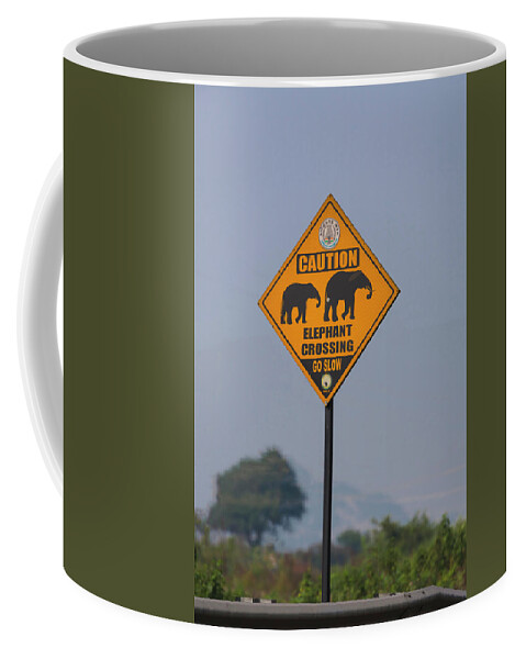 Animal Coffee Mug featuring the photograph Elephant crossing by Maria Heyens