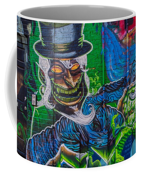 Graffiti Coffee Mug featuring the photograph Graffiti Art Painting of Phantom Paint Sprayer by Raymond Hill