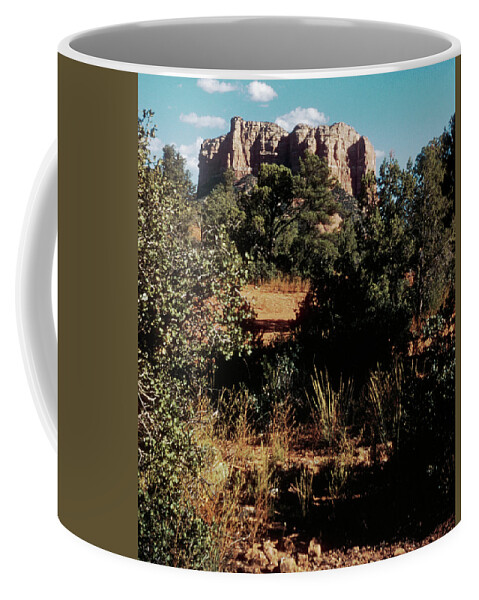 Large sandstone monolith seen beyond a few trees in Oak Creek Canyon -  ARIZ400 00210 Coffee Mug by Kevin Russell - Pixels