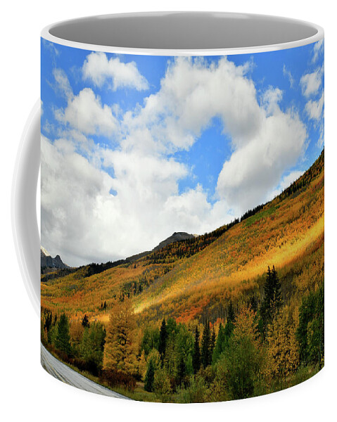 Red Mountain Pass Coffee Mug featuring the photograph Light Breaks Through onto Fall Colors by Ray Mathis