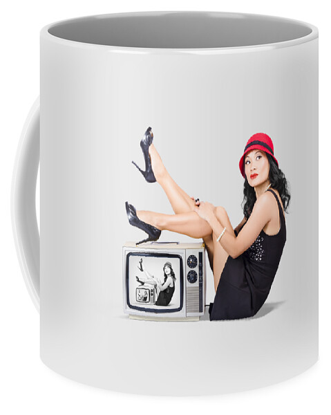 Girl Coffee Mug featuring the photograph Lovely asian pinup girl posing on vintage tv set by Jorgo Photography