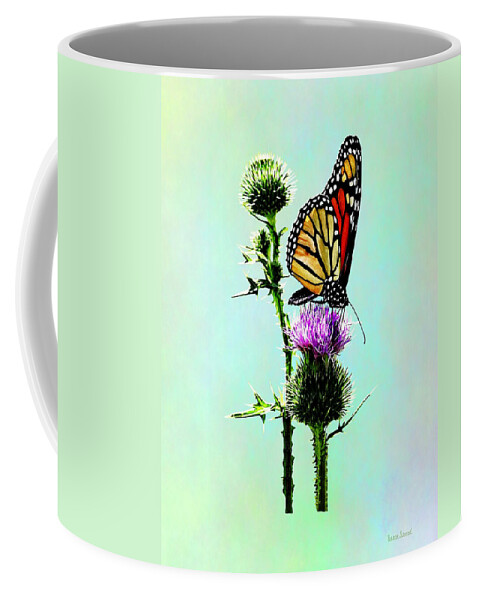 Butterfly Coffee Mug featuring the photograph Monarch on Thistle by Susan Savad