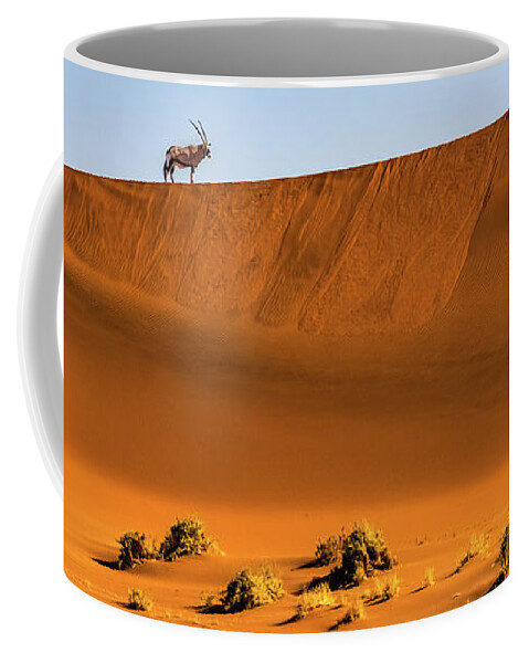 Gemsbok Coffee Mug featuring the photograph Oryx on the dune, Namibia by Lyl Dil Creations