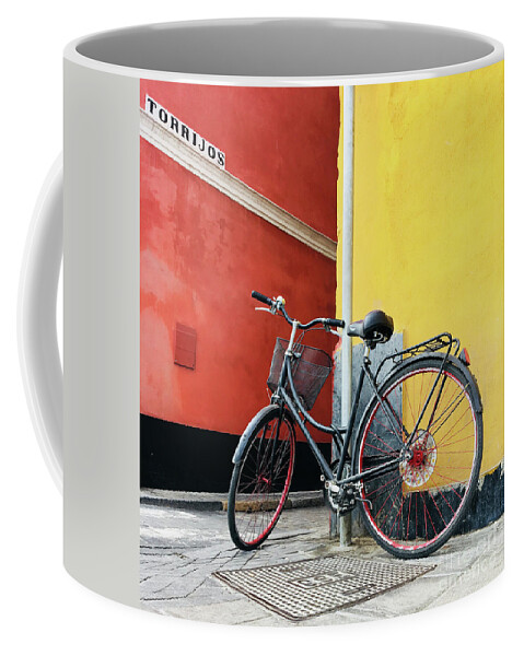 Bicycle Coffee Mug featuring the photograph Seville bicycle by Elena Nosyreva