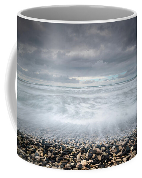 Coast Coffee Mug featuring the photograph Stormy Sky and Wavy ocean by Michalakis Ppalis