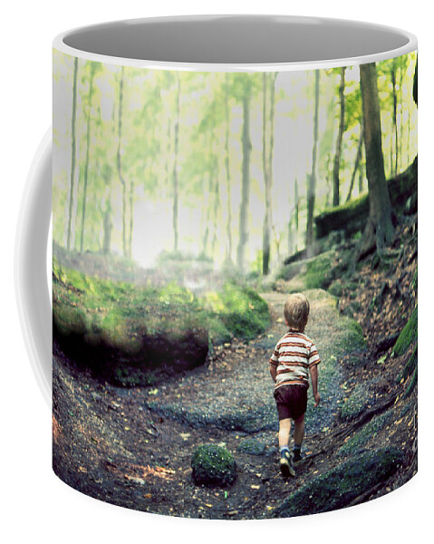 Hiking Coffee Mug featuring the photograph Three year old small boy child hiking alone on an uphill trail in a boulder strewn deciduous forest by Robert C Paulson Jr