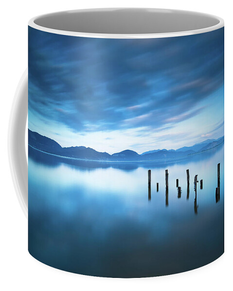 Lake Coffee Mug featuring the photograph Lake and Jetty Remains after Sunset by Stefano Orazzini