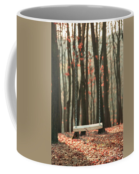 Swing Coffee Mug featuring the photograph Wooden swing in autumn forest by Jelena Jovanovic