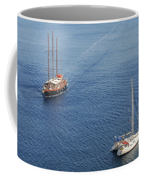Sailing Coffee Mug featuring the photograph Yachts sailing on a blue calm sea by Michalakis Ppalis