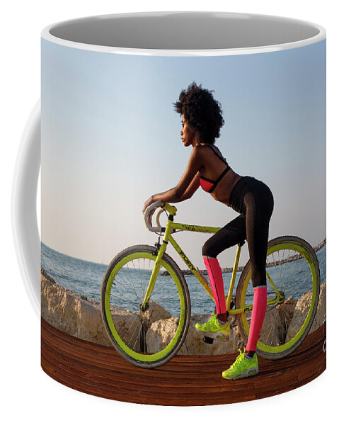 Young Coffee Mug featuring the photograph Young athletic woman with bicycle k2 by Ami Siano
