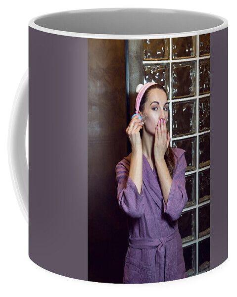 Young Girl In A Purple Robe Stands In The Bathroom And Makes A Pear Face  Massage Coffee Mug