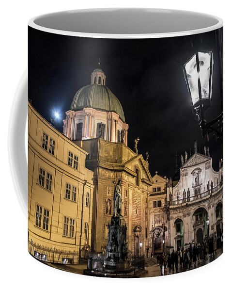 Prague Coffee Mug featuring the photograph Historic Buildings Beneath The Tower Of Charles Bridge In The Night In Prague In The Czech Republic by Andreas Berthold