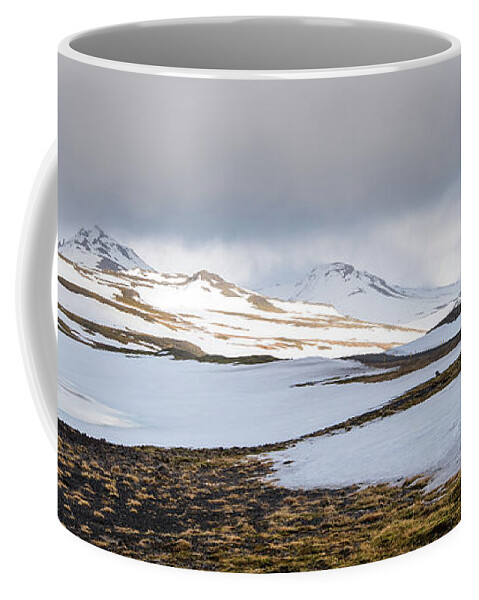 Iceland Coffee Mug featuring the photograph Icelandic landscape with mountains and meadow land covered in snow. Iceland by Michalakis Ppalis